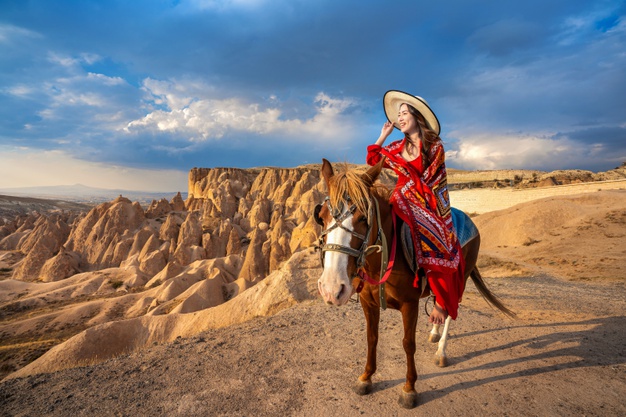 tourists-enjoy-ride-horses-cappadocia-turkey_335224-575-1